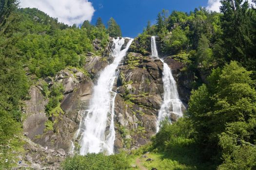 beautiful alpine waterfall in Val di Genova, Trentino, Italy