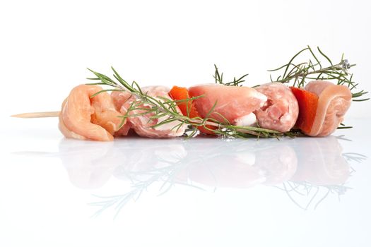 raw pork kebab with rosemary isolated on white background 