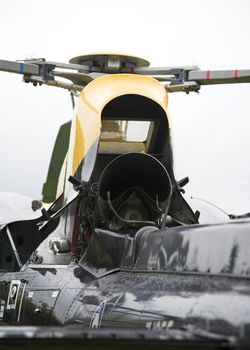 Detail of a parked military helicopter.