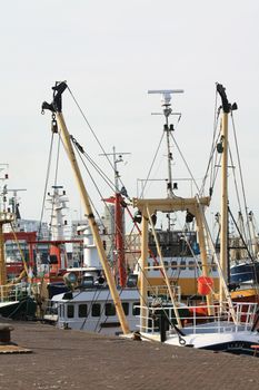 A couple of fish trawlers in a harbor