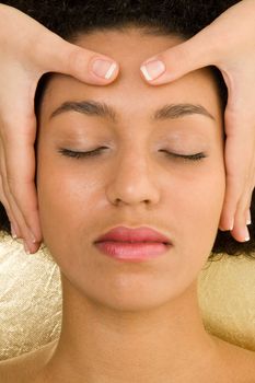 Spa resort. Beautiful girl receiving head massage