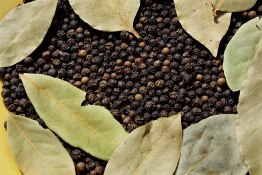 Close up of the bay leaves and black pepper.