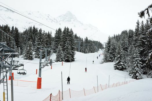 Platter lift with skiers at Meribel ski resort, France