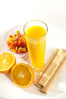 food series: ripe sliced orange and juice with pastry