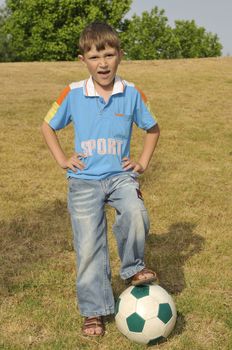 The boy calls friends to play football