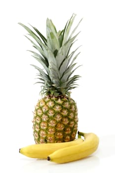 Pineapple with bananas on white background