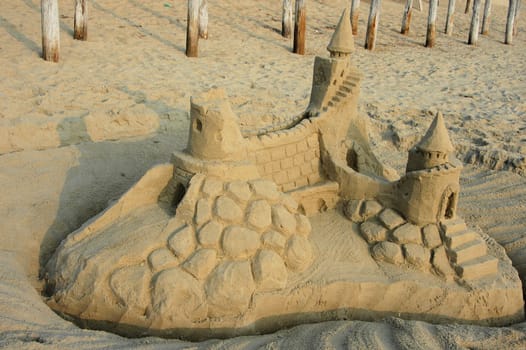 An elaborate sand castle on the beach