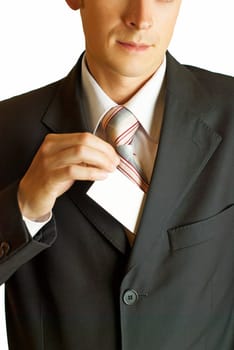 Young businessman holding blank visit card. Backside. Isolated.