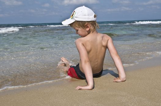 good warm weather, the boy resting on the seashore