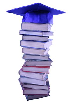 Graduation cap on top of book stack