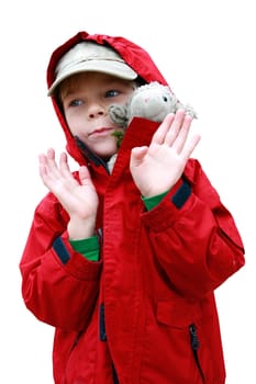 Portrait of small boy in red jacket with toy lambkin isolated on white with included clipping path