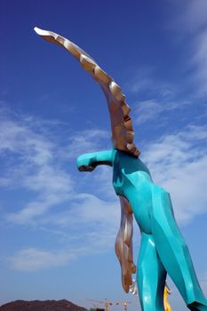 China South Sea, Guangdong province. Shenzhen city - sea side, wide beach at DaMeiSha. Large angels sculptures standing at the beach.