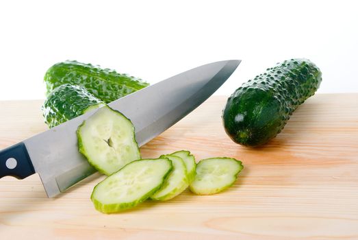 The Cutting by knife of  cucumber.Close up.