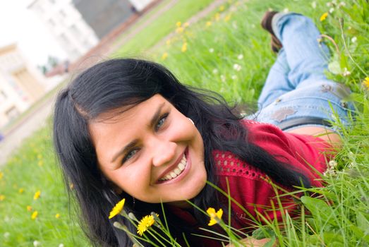 lovely female model.beautiful girl lying down of grass.