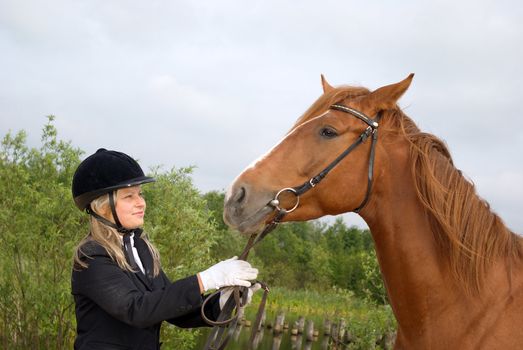 Girl -a jockey and horse