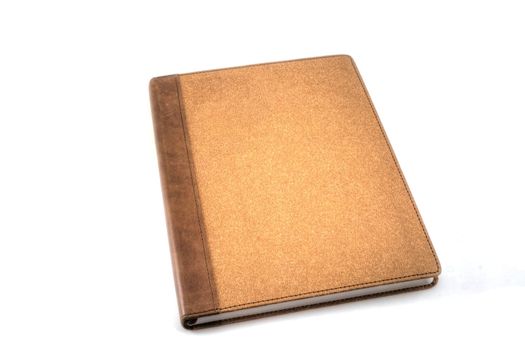 A brown travel journal isolated on white.