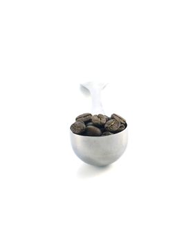 spoon full of coffee beans isolated on white background