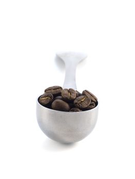 spoon full of coffee beans isolated on white background