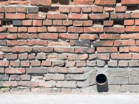 Brick wall with tube