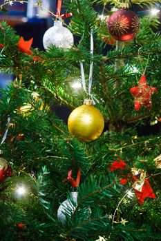 Christmas balls garland and lights on the fir tree