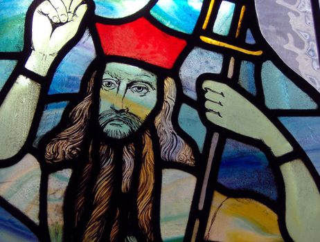 Details of a stained glass window in a church.