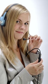 Business woman with headset holds device