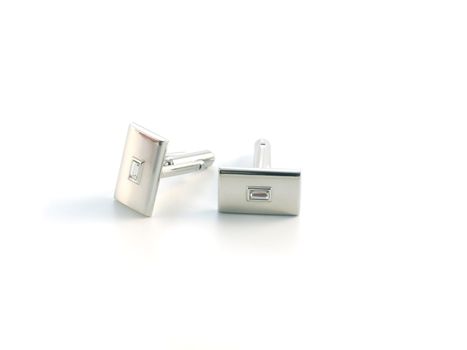 silver cuff link isolated on white background