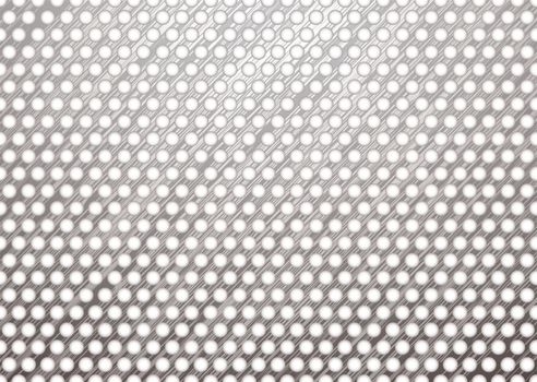silver metal background with brushed surface and white holes