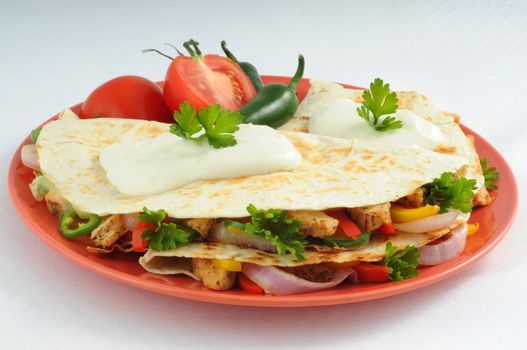 Delicious and tasty cheese and chicken quesadillas.