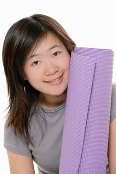 Sport girl with yoga mat and smile on white background.