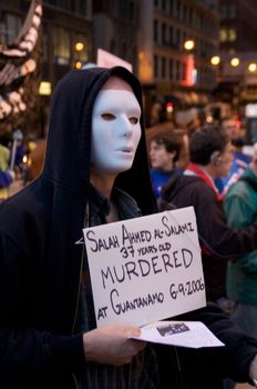 CHICAGO, IL-MAR. 18, 2010: Protesters march through downtown Chicago, demonstrating against US military involvement in Iraq and Afghanistan on March 18, 2010.