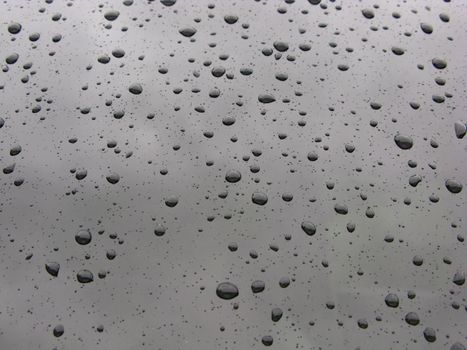 raindrops on tinted glass