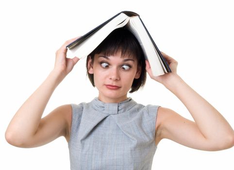 Study dements. Lunatic aspect. Mad girl with big book on a white background.