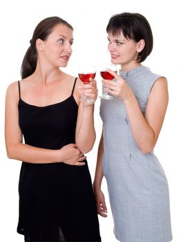 Party. Two beautiful girls with wine, isolated on white. 