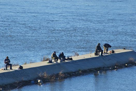 Five fisherman's fishing in Vistula River. 