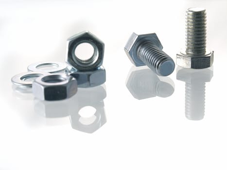 screws and nuts on a white background