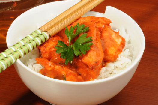 Delicious butter chicken served on white rice.