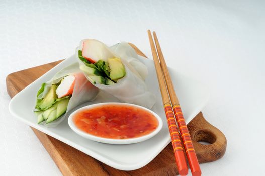 Delicious seafood sushi served with ginger dipping sauce.