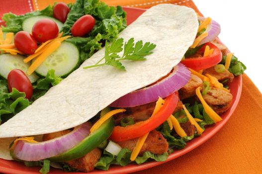 Delicious chicken fajitas served with a fresh salad.