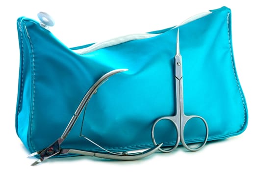 Blue beautician and nail scissors - manicure set on isolated background.