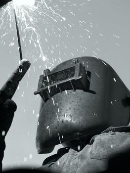 a metal welder busy at work