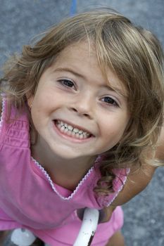 a picture of a cute little girl smiling