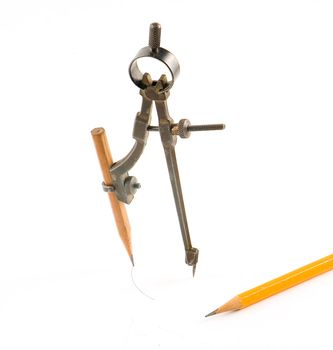 Compasses and pencil on white background. Isolated objects.

