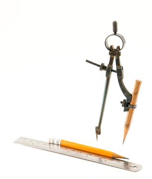 Compasses and pencil on white background. Isolated objects.