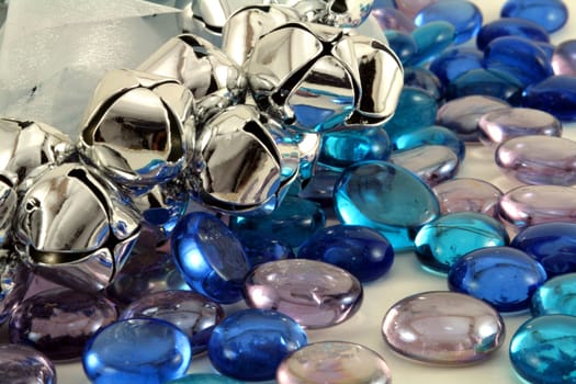 Silver Christmas bells with blue glass stones.