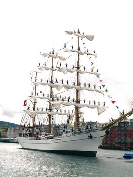 sailboat with sailors in sail