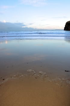 an icy beach view of the sea and cliffs in ballybunion co kerry ireland