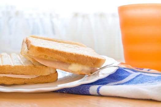 Early breakfast table with toasts and juice.