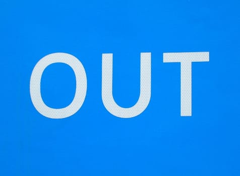 Details of white Out sign on blue background.