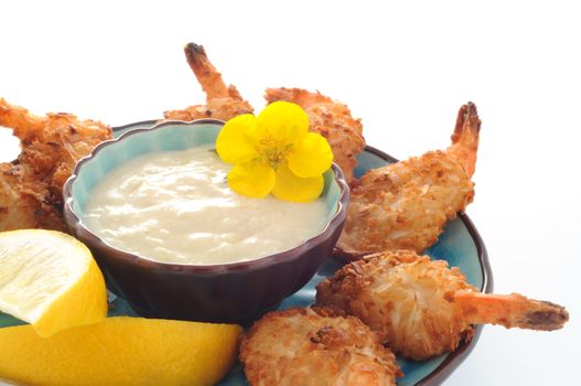 Tasty fried coconut shrimp with dipping sauce.